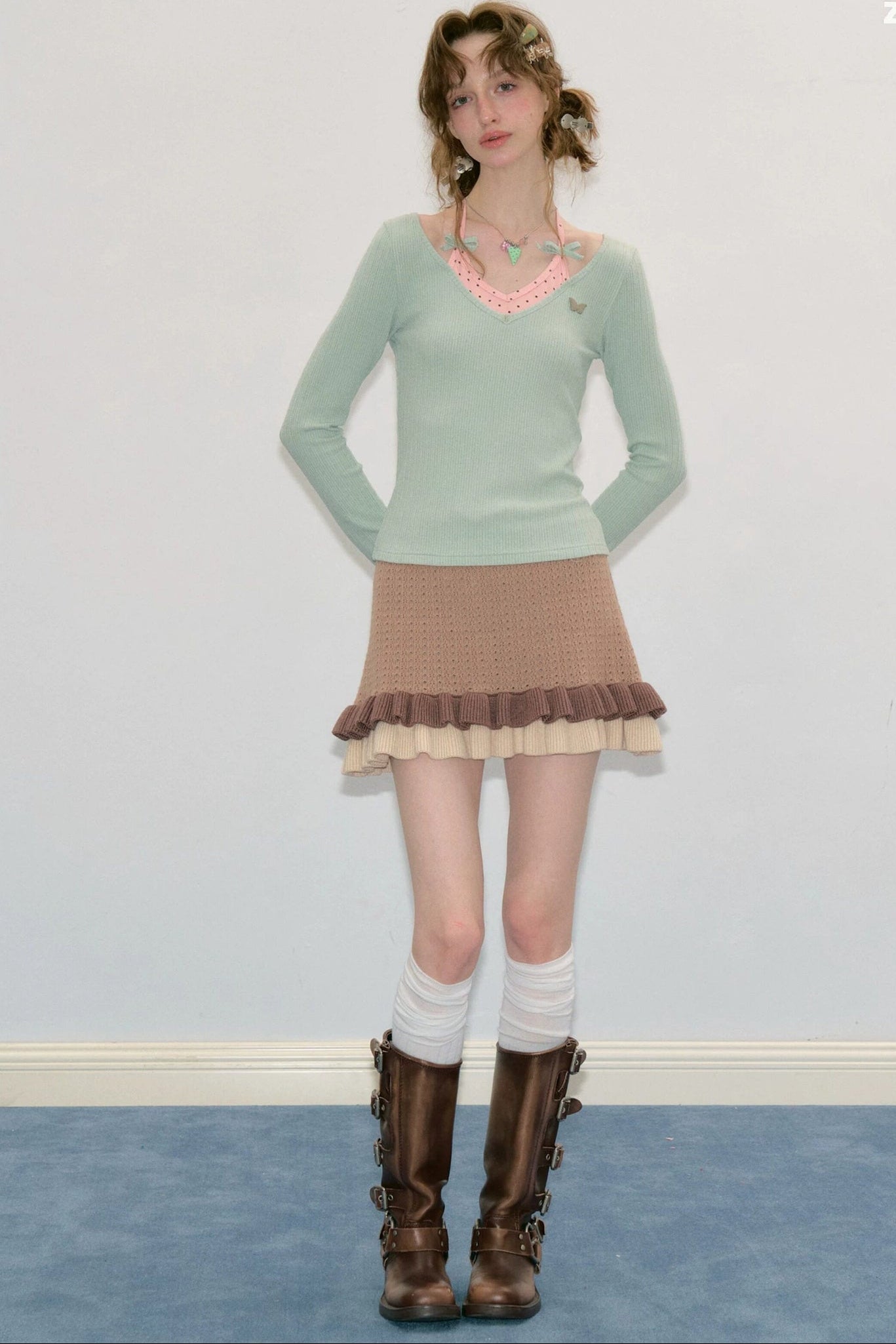 Top a maglia a maniche lunghe con farfalle e pois