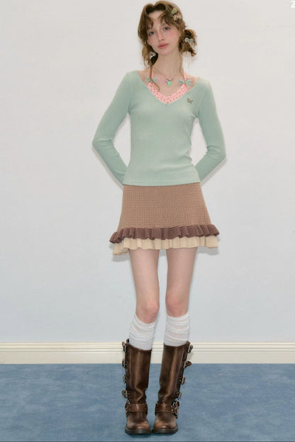 Top a maglia a maniche lunghe con farfalle e pois
