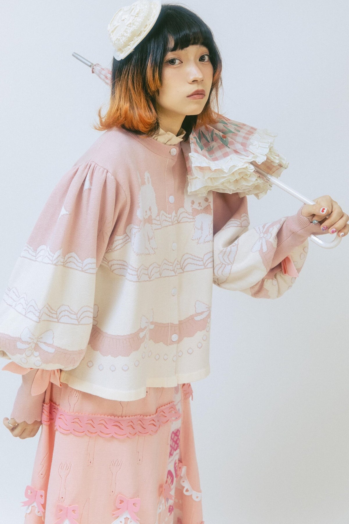 Cardigan a maglia con fiocco e coniglio