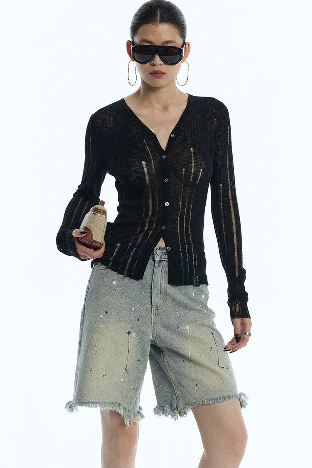 Cardigan en maille noir rayé à découpes