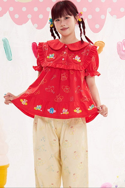 Blusa rossa con ricamo animale e angelo