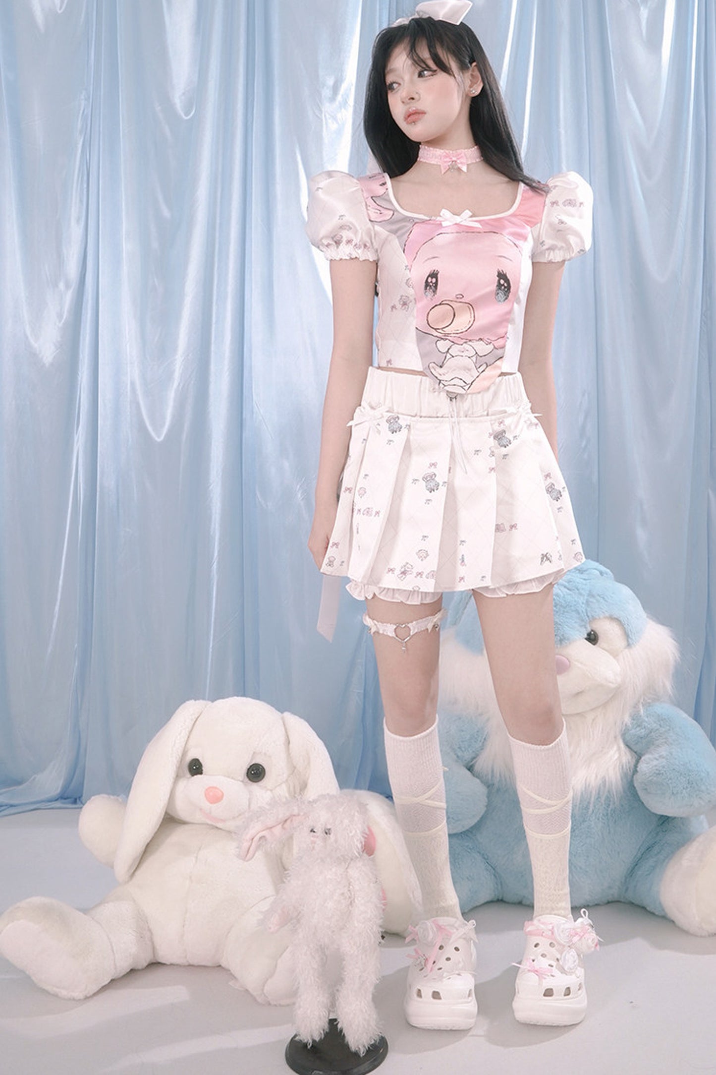 Blusa con stampa angeli e maniche a sbuffo