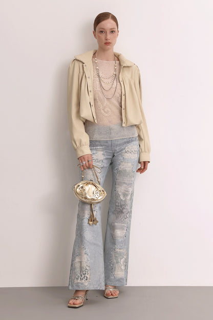 Jeans in mesh leopardato slavato a doppio strato