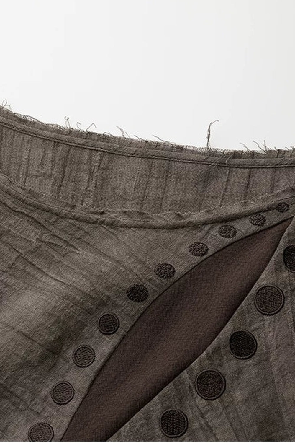 Asymmetrical Eye Embroidery Knit Top