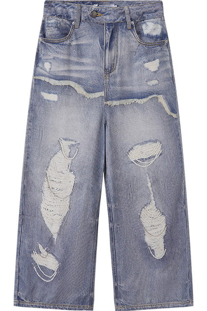 Jeans a gamba larga con stampa effetto strappato e look a strati