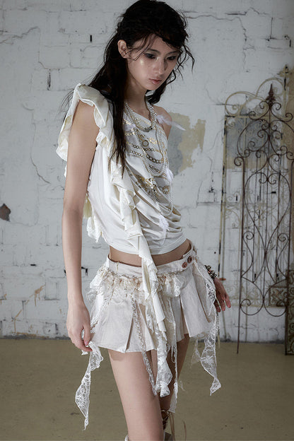 Maglia asimmetrica con catena effetto lamina d'oro