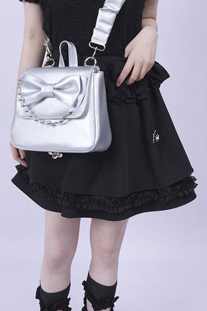 Silver Bow Crossbody Backpack