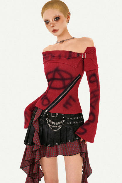 Completo con gonna asimmetrica a quadri con cintura con nappine e top in maglia