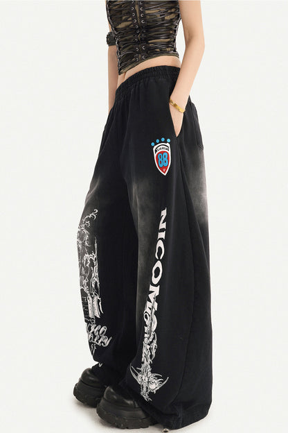 Pantaloni sportivi a gamba larga con stampa grafica