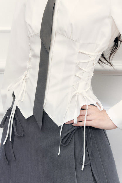 Ensemble blouse à nœud coulissant et jupe