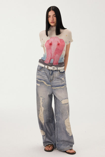 Jeans a gamba larga con stampa effetto strappato e look a strati