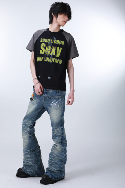 Wendbare Schlagjeans mit Taschen, Patchwork und Stickerei
