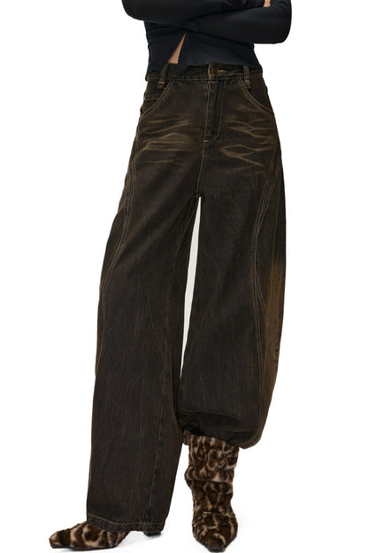 Jeans a gamba larga effetto vissuto e slavato con motivo a scimitarra
