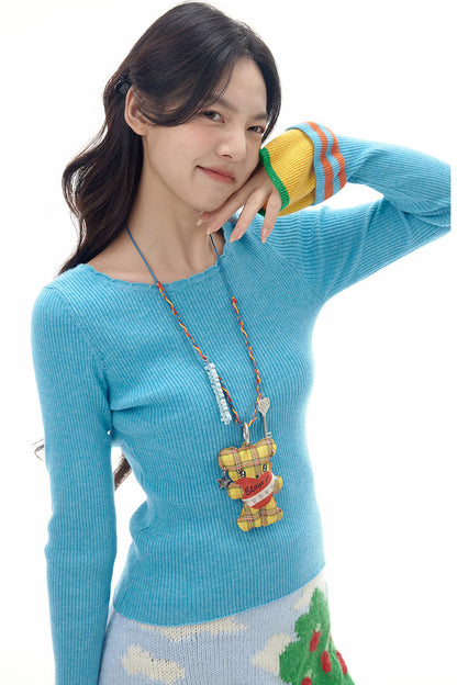 Collier long avec pendentif ours à carreaux