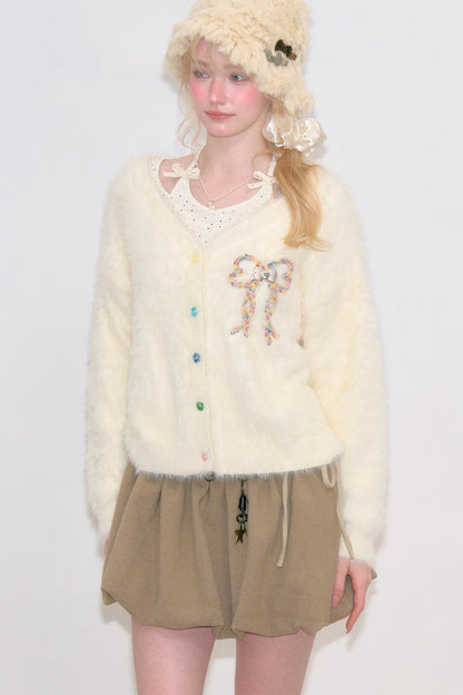 Apricotfarbene Strickjacke mit Schleife