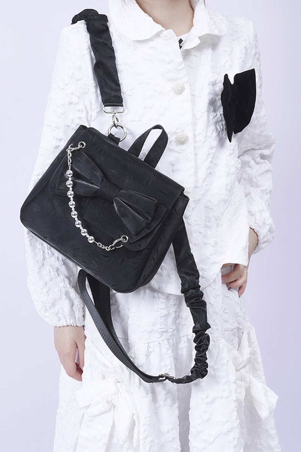 Silver Bow Crossbody Backpack