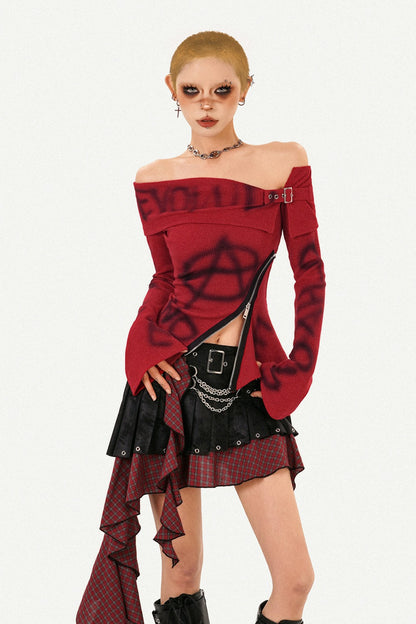 Completo con gonna asimmetrica a quadri con cintura con nappine e top in maglia