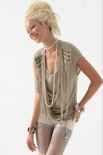 Top in maglia drappeggiato con nappine