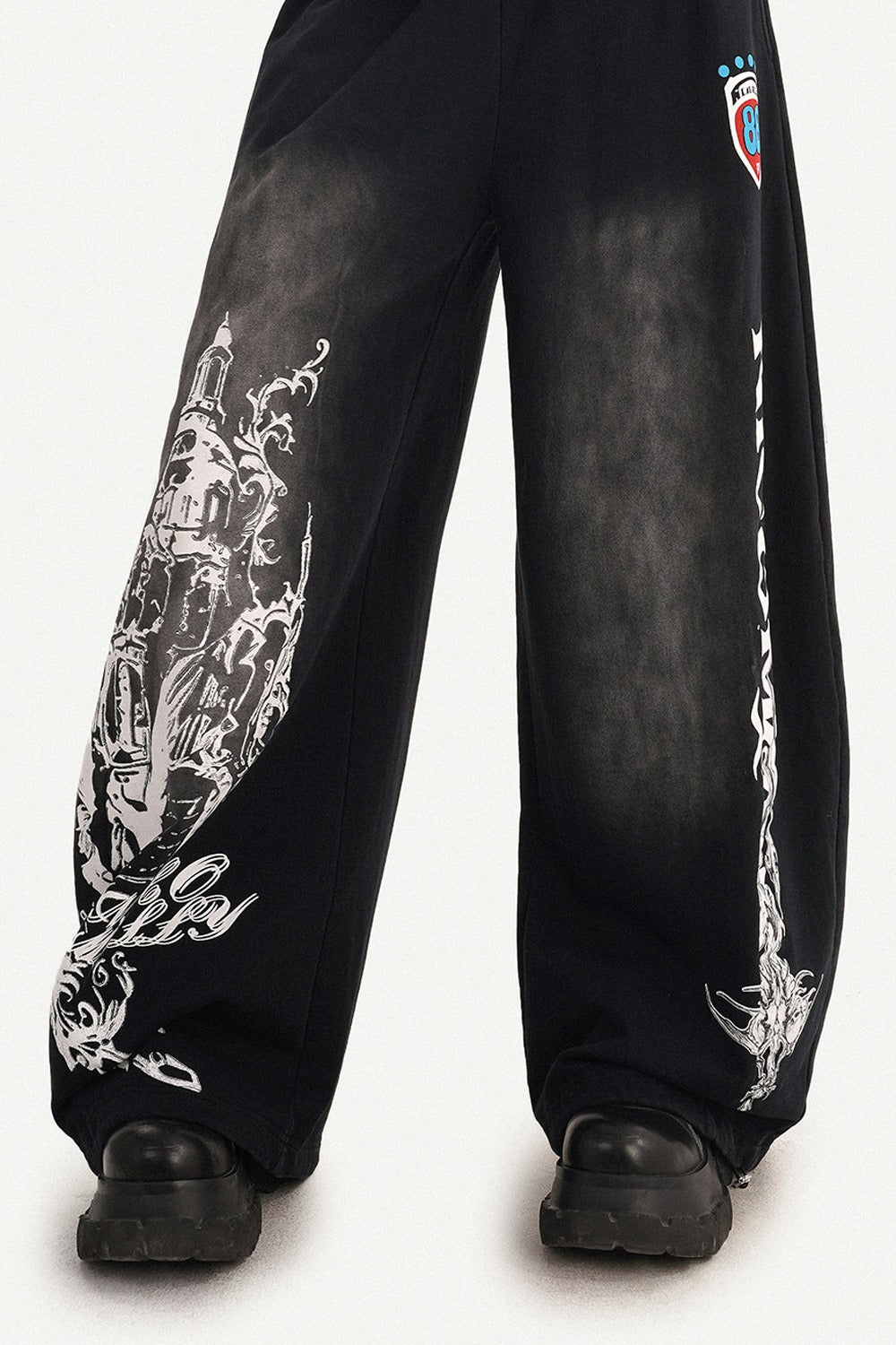Pantaloni sportivi a gamba larga con stampa grafica
