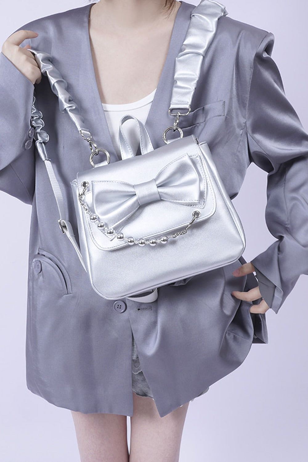 Silver Bow Crossbody Backpack