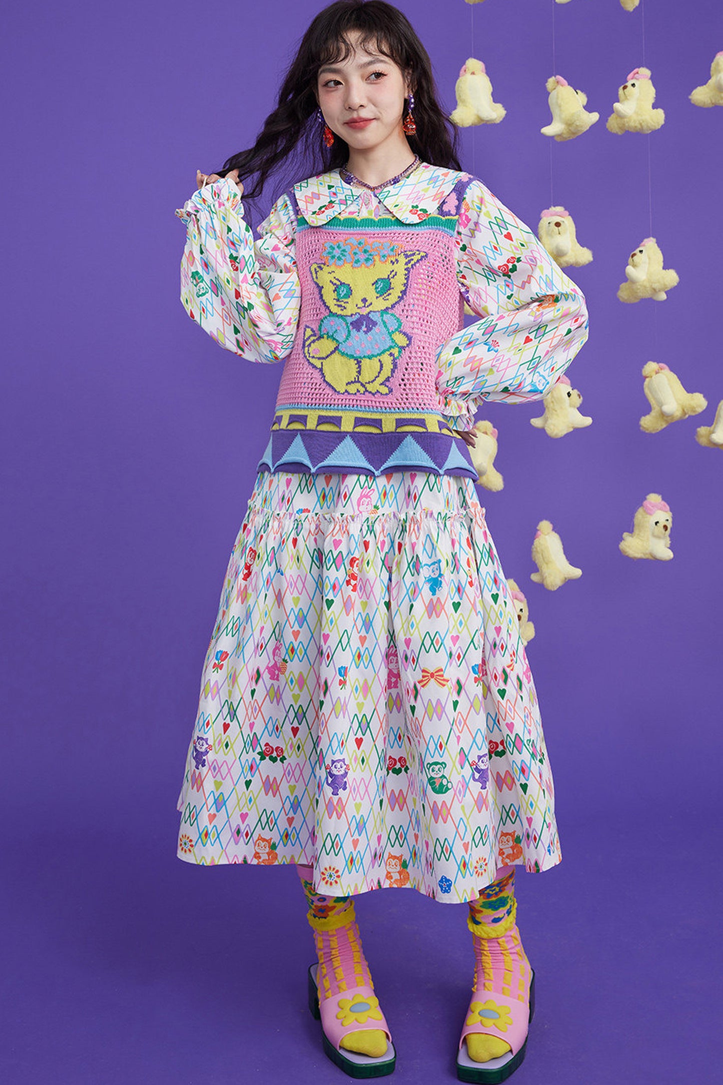 Gilet en maille ajourée à motif chaton rose