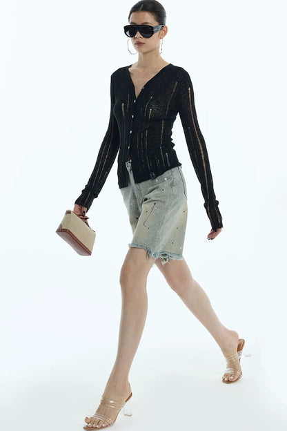 Cardigan en maille noir rayé à découpes