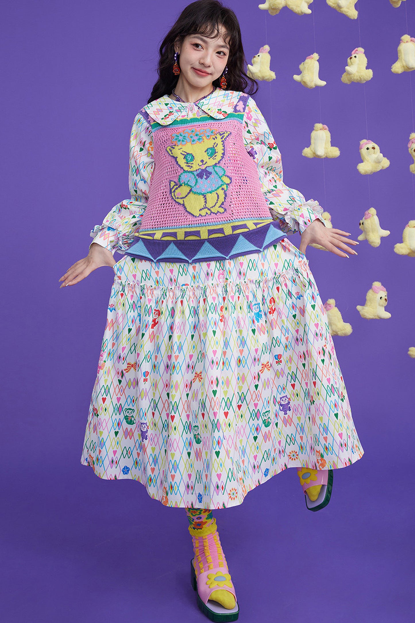 Gilet en maille ajourée à motif chaton rose