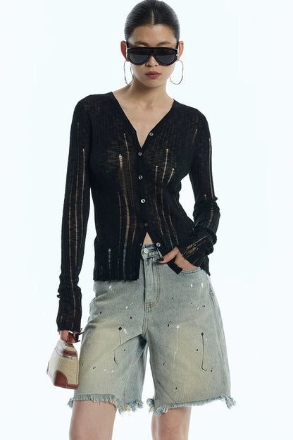 Cardigan en maille noir rayé à découpes