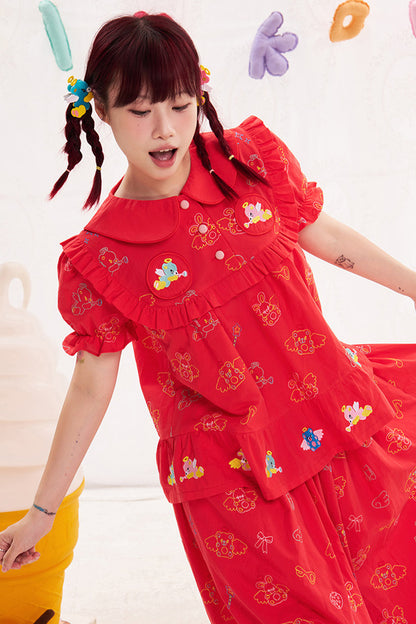 Blusa rossa con ricamo animale e angelo