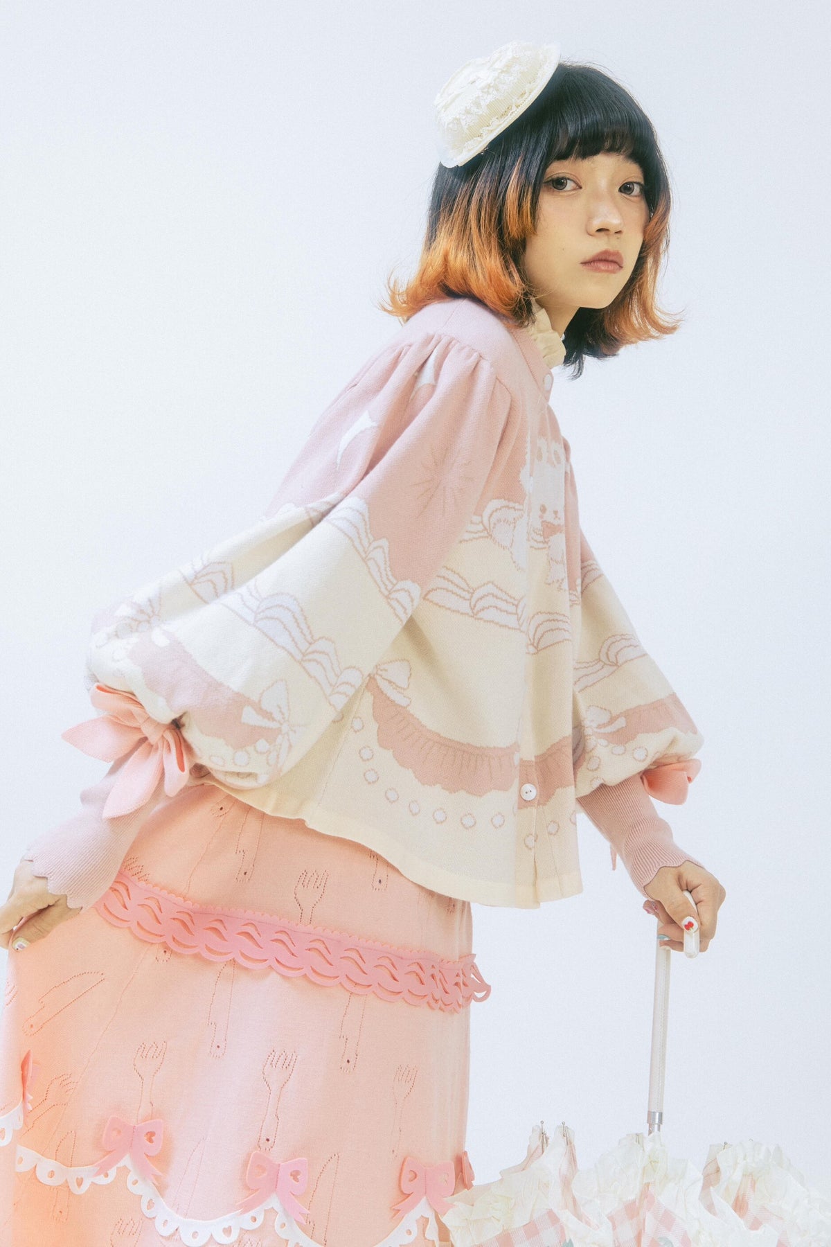 Cardigan a maglia con fiocco e coniglio