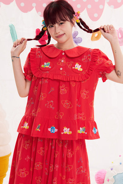 Blusa rossa con ricamo animale e angelo