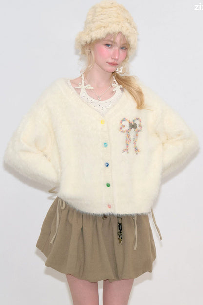 Apricotfarbene Strickjacke mit Schleife