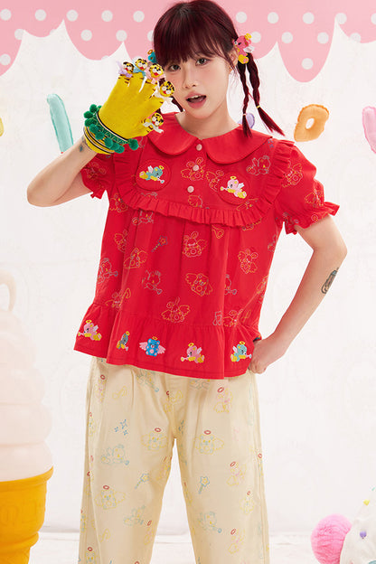 Blusa rossa con ricamo animale e angelo