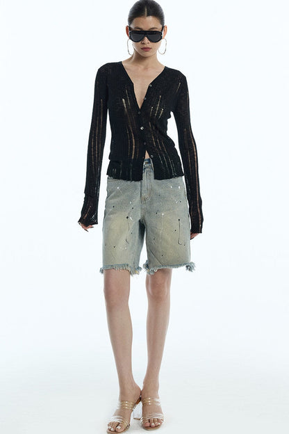 Cardigan en maille noir rayé à découpes