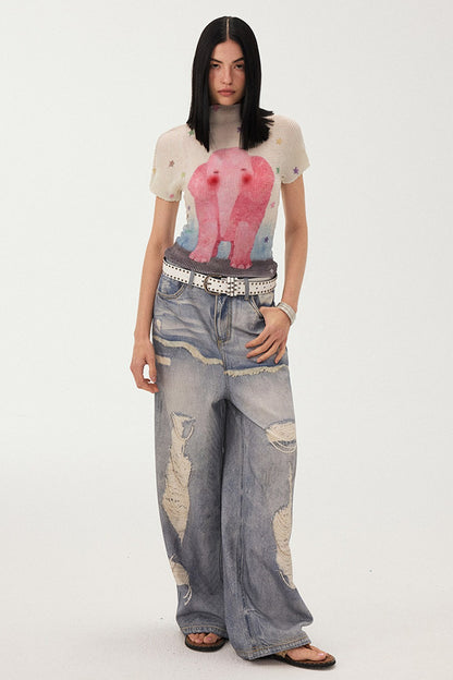 Jeans a gamba larga con stampa effetto strappato e look a strati