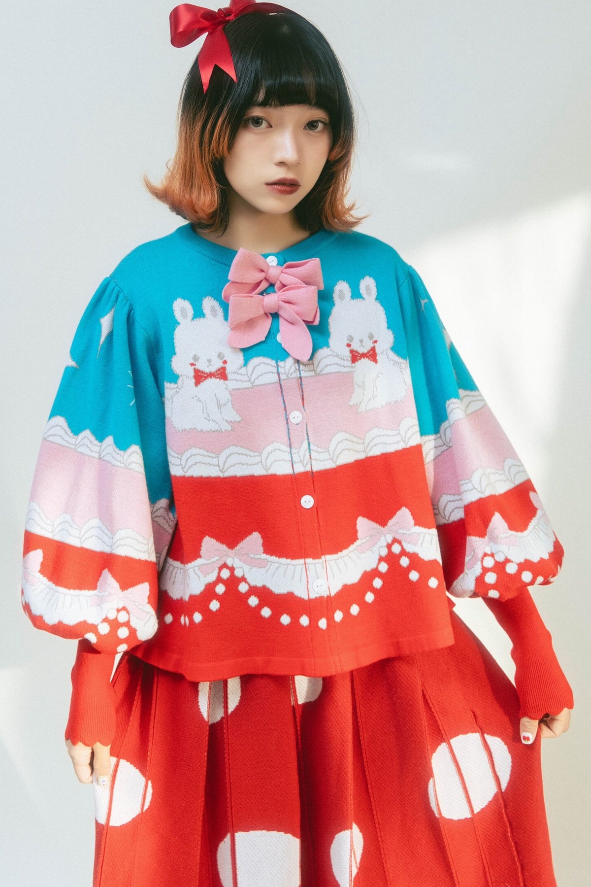 Cardigan a maglia con fiocco e coniglio