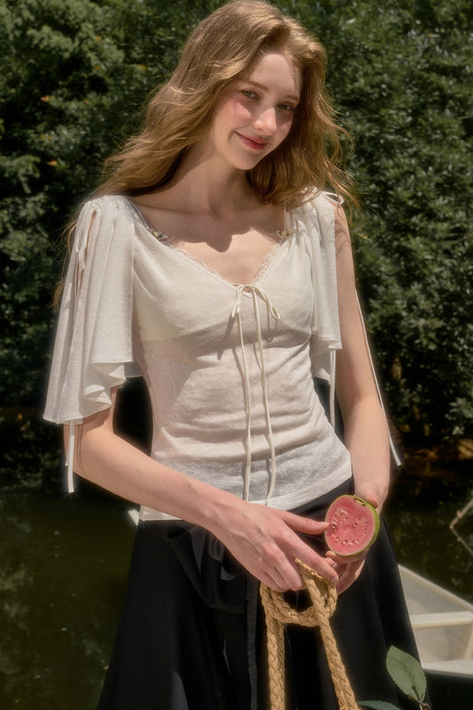 Completo coordinato con top a maniche corte stile mantella e abito