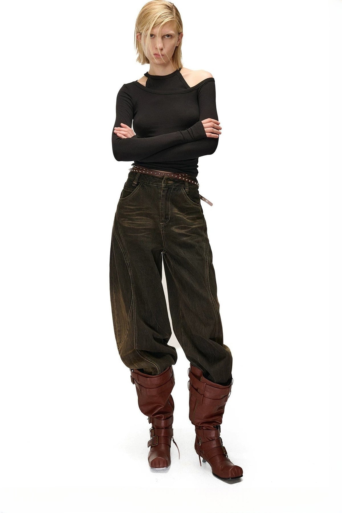 Jeans a gamba larga effetto vissuto e slavato con motivo a scimitarra