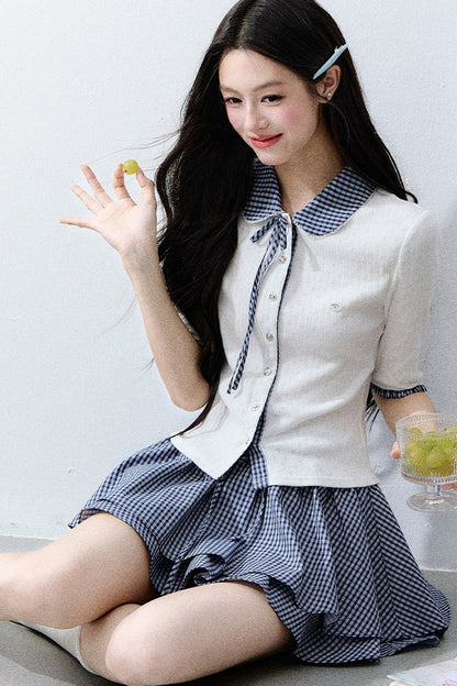 Completo cardigan a maglia bianco con colletto a quadri