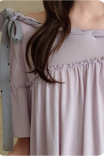 Blusa a spalle scoperte con fiocco al collo e maniche corte