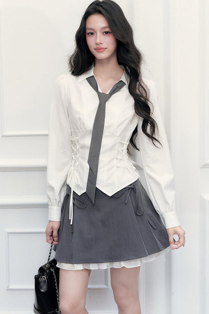 Ensemble blouse à nœud coulissant et jupe