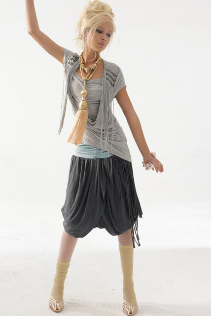 Top in maglia drappeggiato con nappine