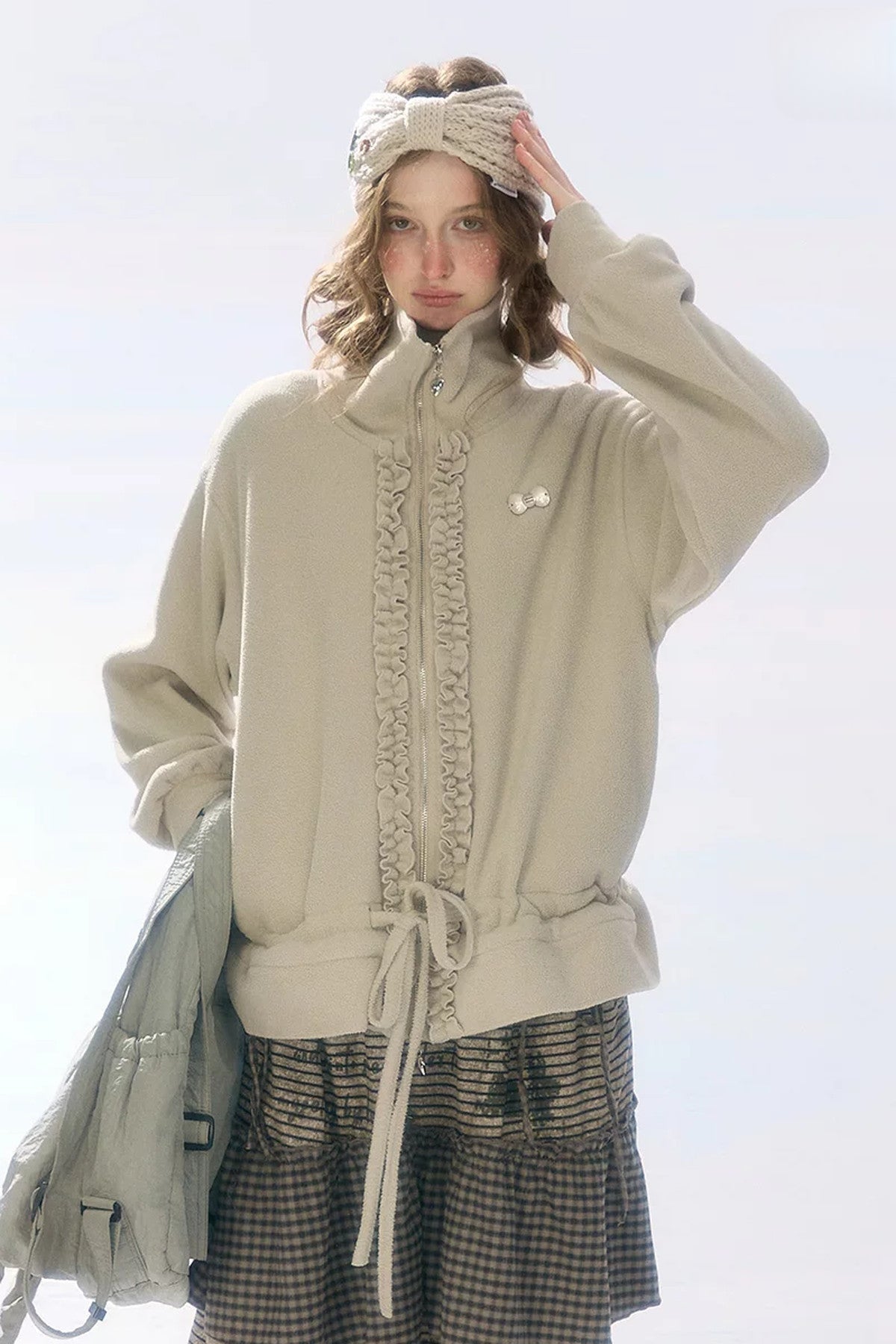 Veste en polaire grise et abricot à fermeture zippée et cordon de serrage