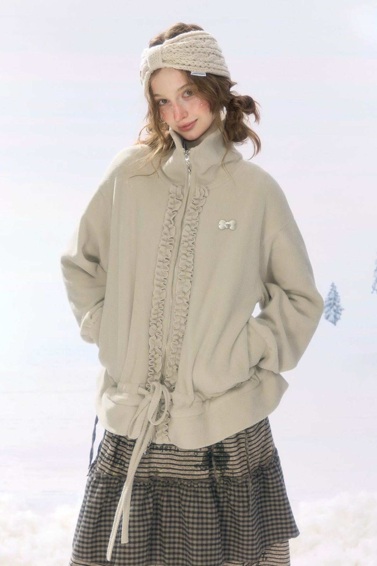 Veste en polaire grise et abricot à fermeture zippée et cordon de serrage