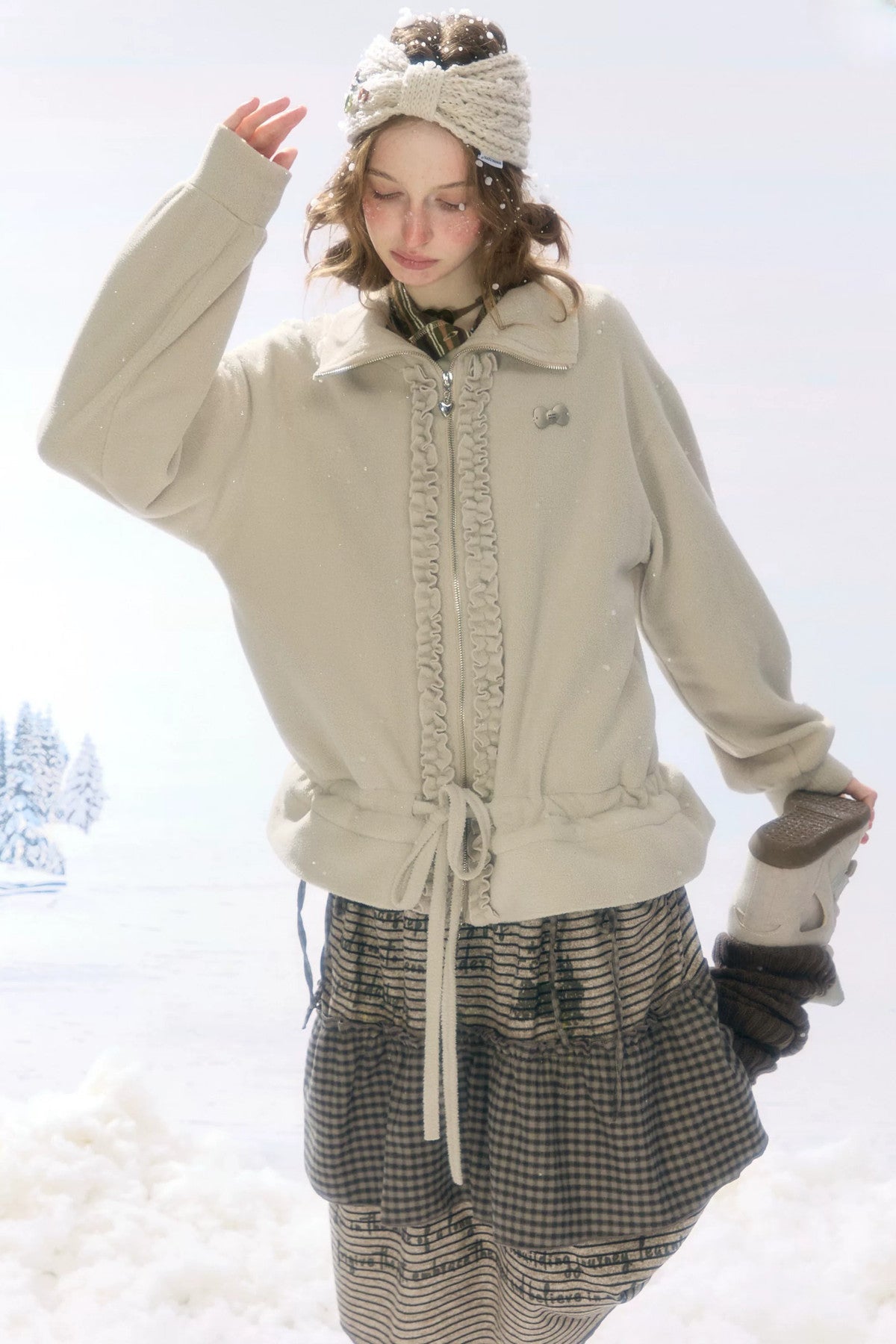 Veste en polaire grise et abricot à fermeture zippée et cordon de serrage