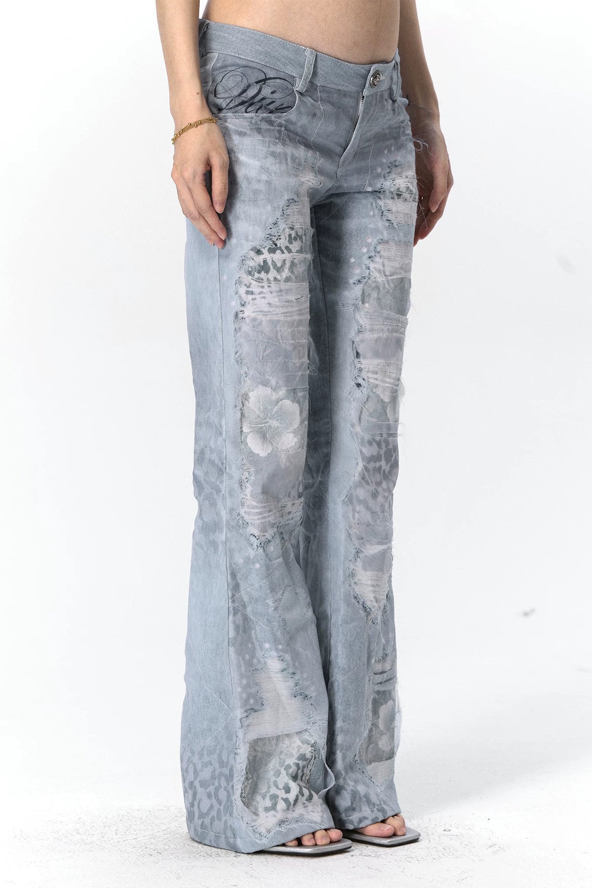 Jeans in mesh leopardato slavato a doppio strato