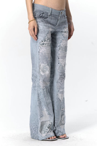 Jeans in mesh leopardato slavato a doppio strato