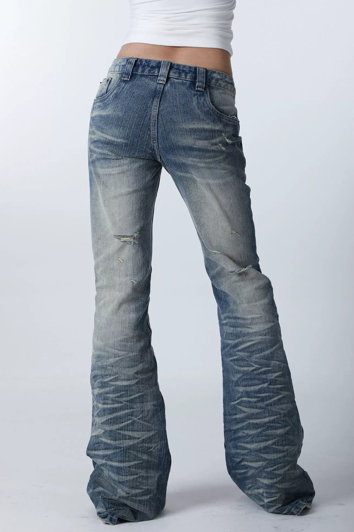 Wendbare Schlagjeans mit Taschen, Patchwork und Stickerei